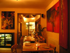 Restaurant Photo 1 - Warm coloured front dining area stretching through archway to rear dining area and kitchen. Thumbnail